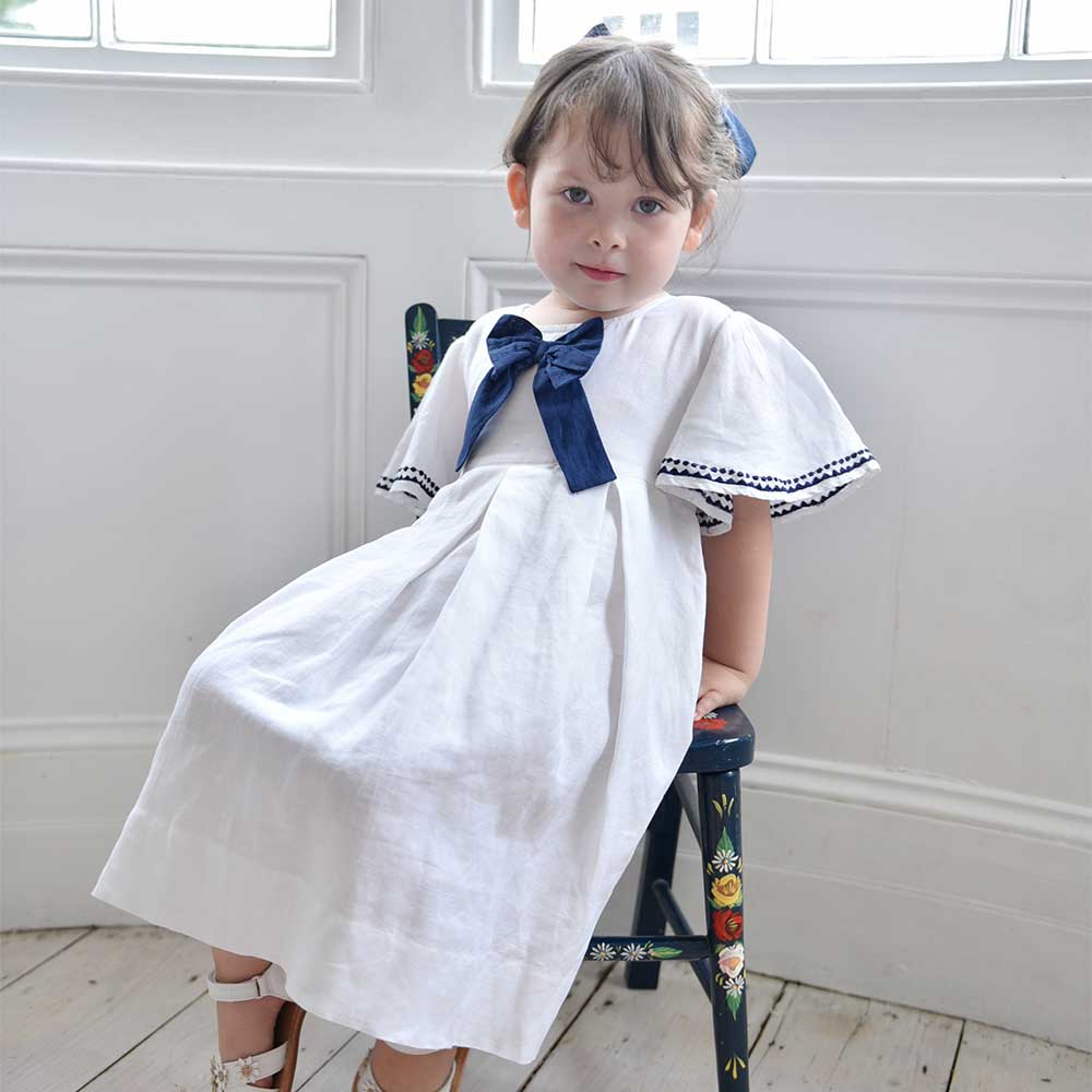 White Linen Girls Dress With Navy Bow
