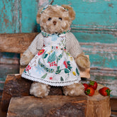 Teddy Wearing White Berry Dress And Hand Knitted Cardigan